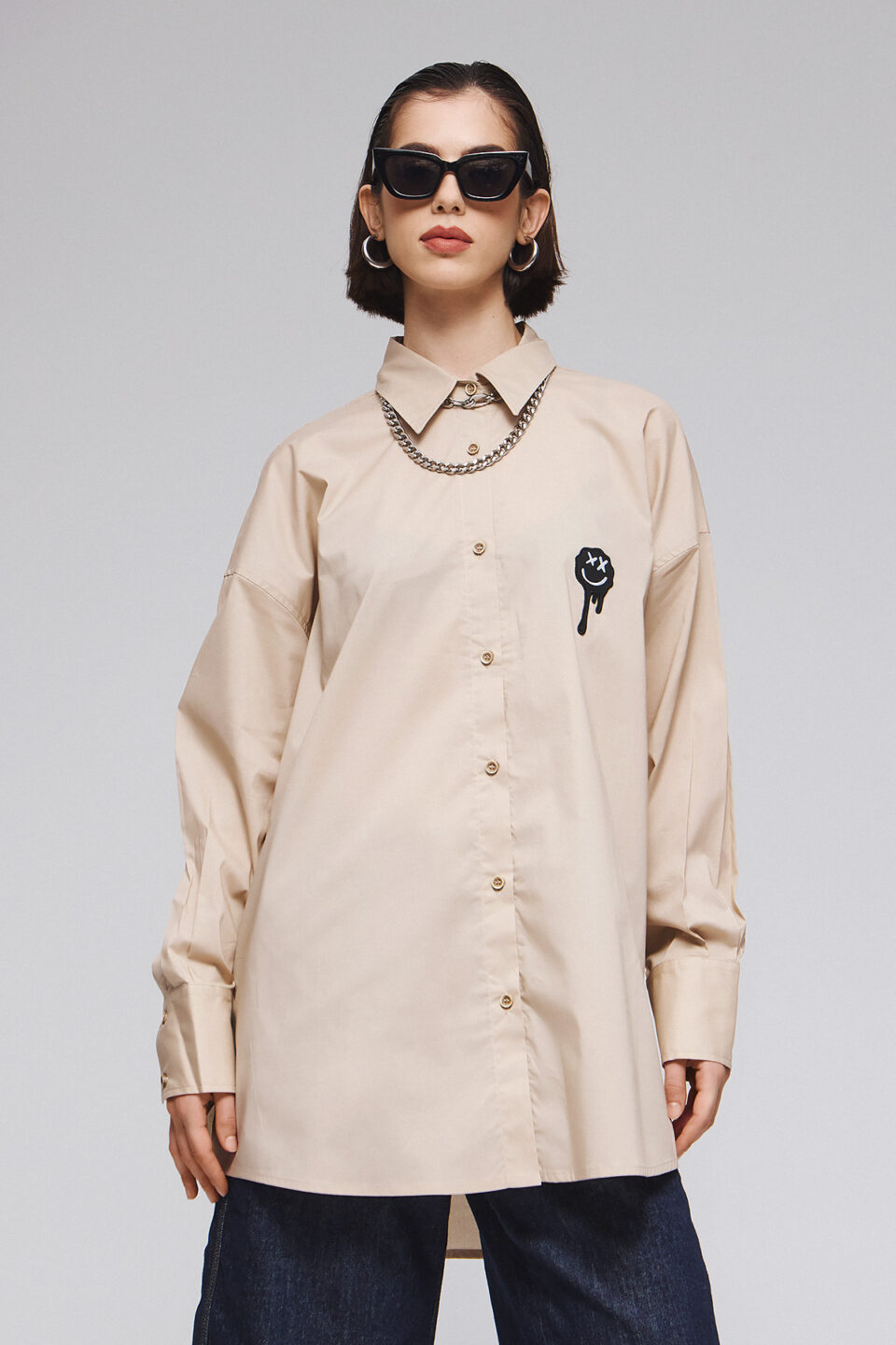 OVERSIZED BEIGE SHIRT WITH GRAPHIC PATCHES